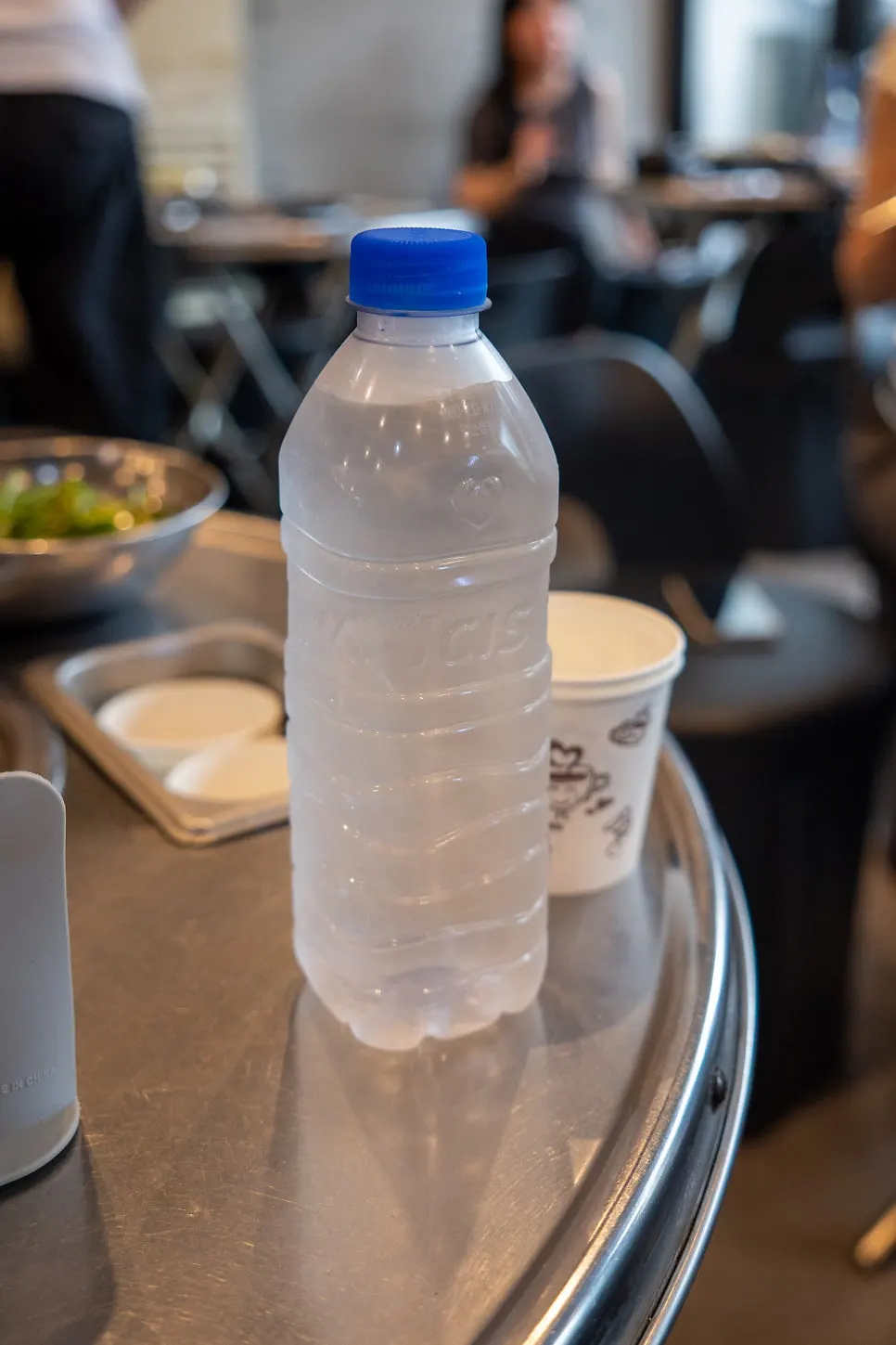Table setting with individually wrapped utensils and bottled water