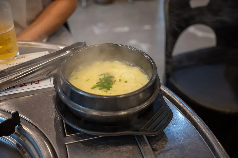 Warm complimentary steamed egg