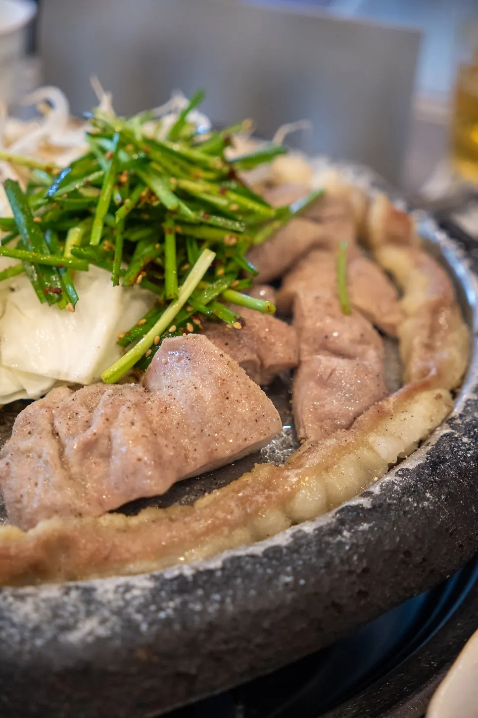 A plate of beef gopchang and makchang on the grill