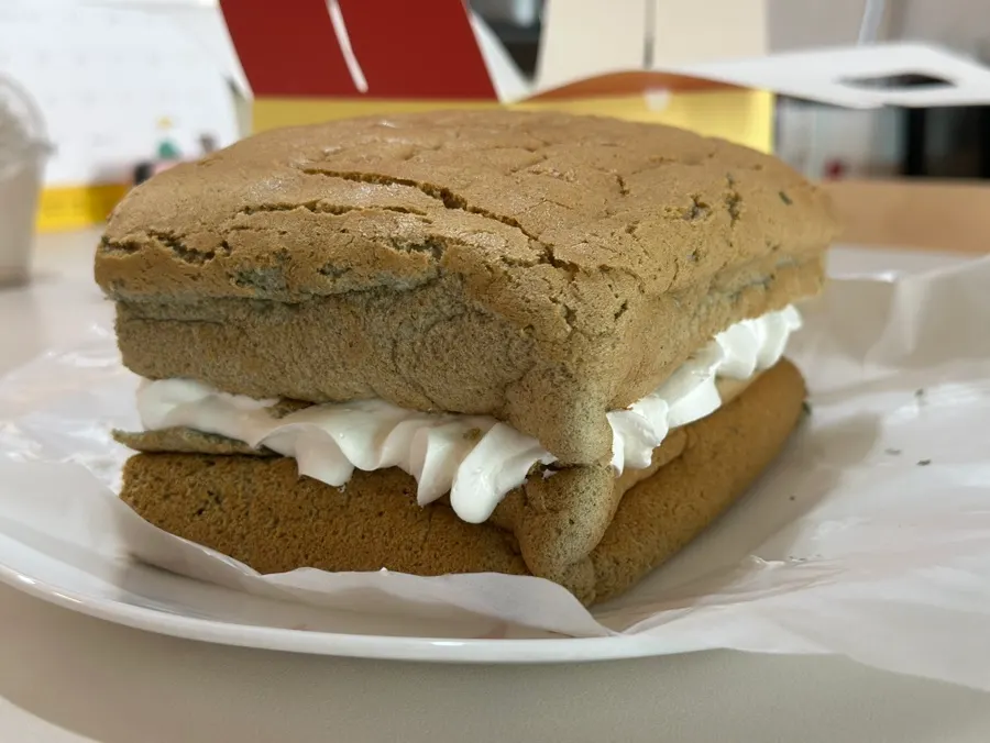 Mugwort castella packed full of whipped cream between the layers