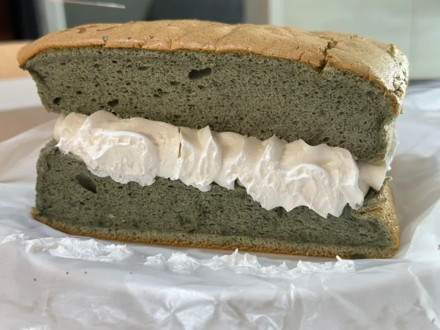 Castella showing contrast between the mugwort bread and white cream