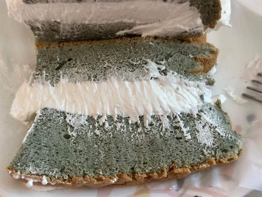 A slice of mugwort whipped cream castella on a plate
