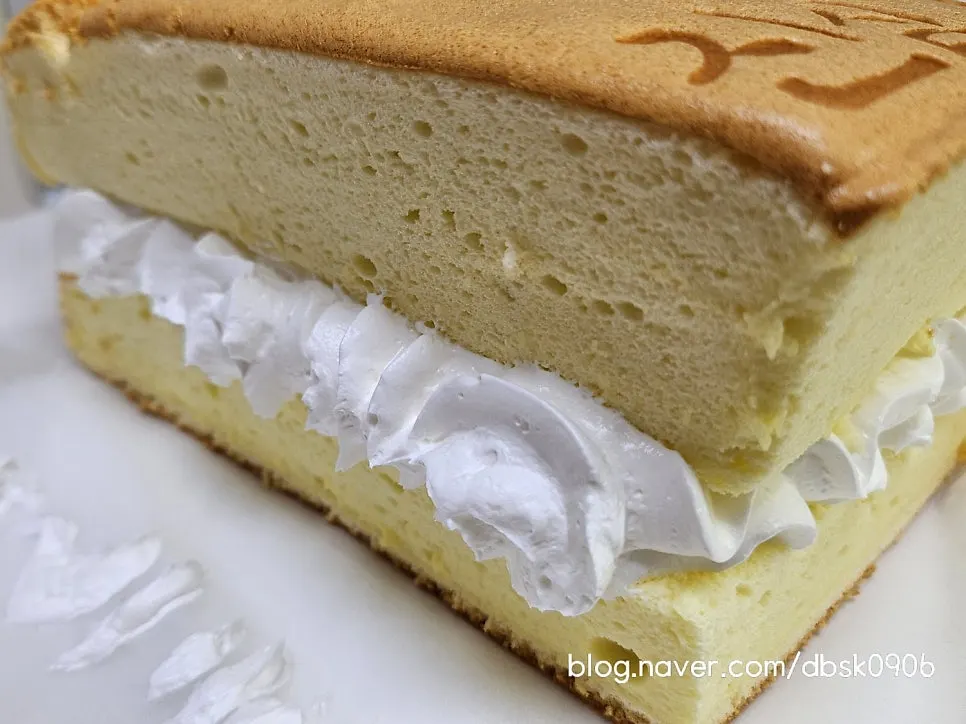 A cross-section of sliced whipped cream castella