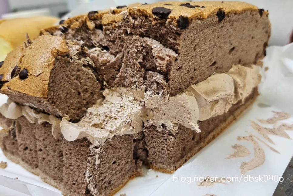 Cross-section of chocolate castella with chocolate whipped cream