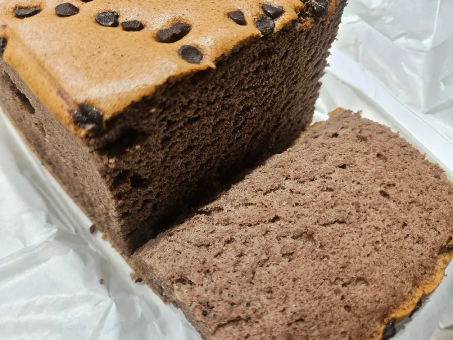 Cross-section of chocolate castella showing a tight crumb