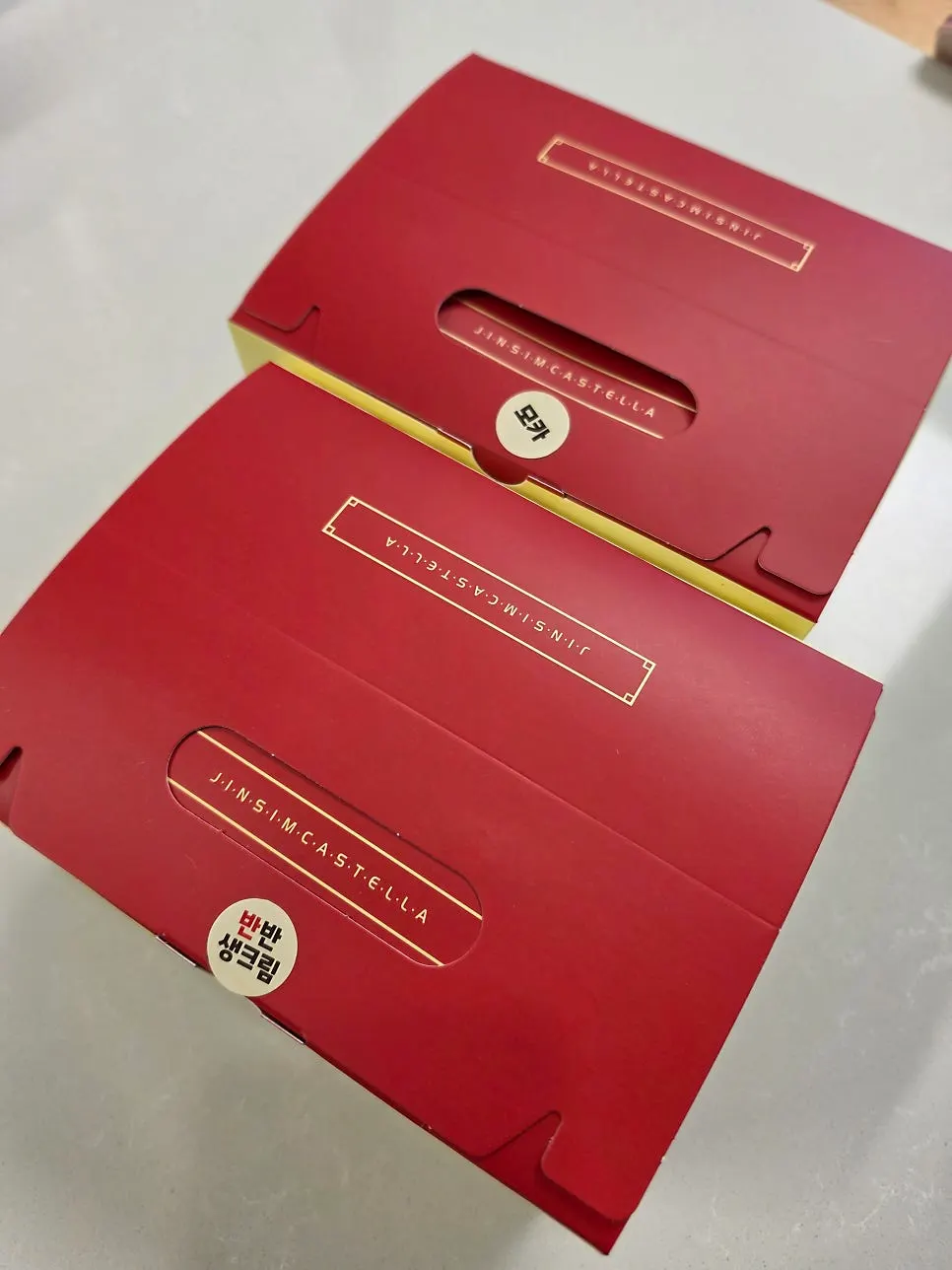 Golden-baked castella inside the opened box
