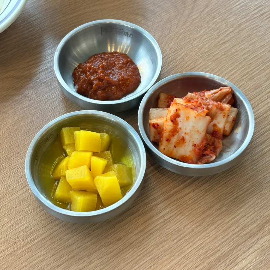 Utensils and side dishes gathered self-serve