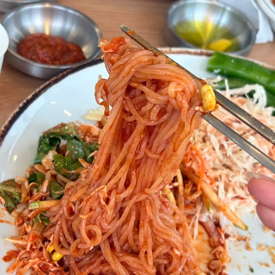 Close-up of spicy-tangy jjolmyeon noodles