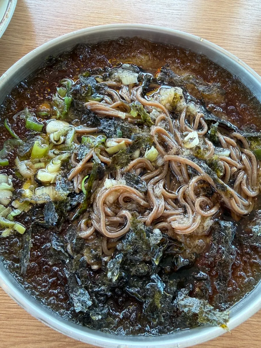 Udon broth with fish cake and boiled egg