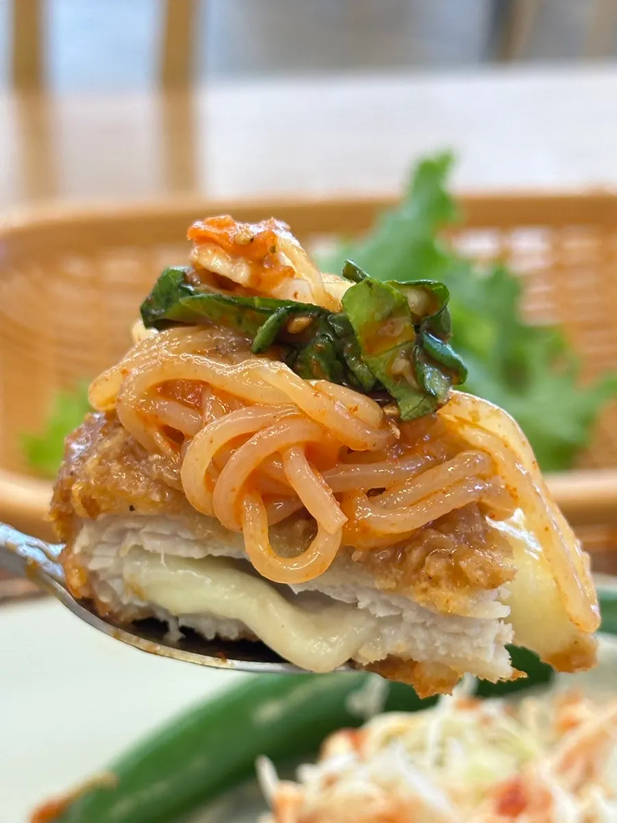 Tangy-spicy jjolmyeon paired with the cutlet