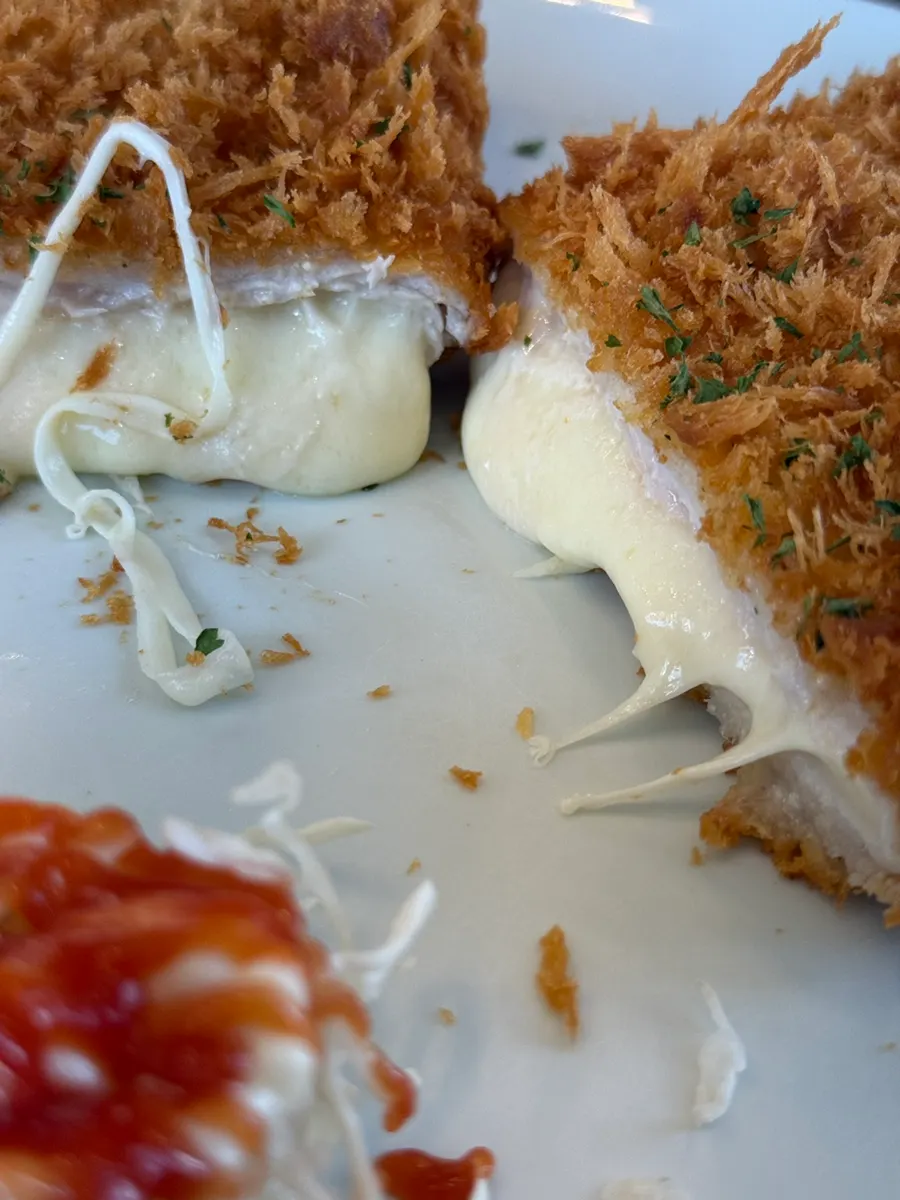 Cross-section of the cheese cutlet cut in half
