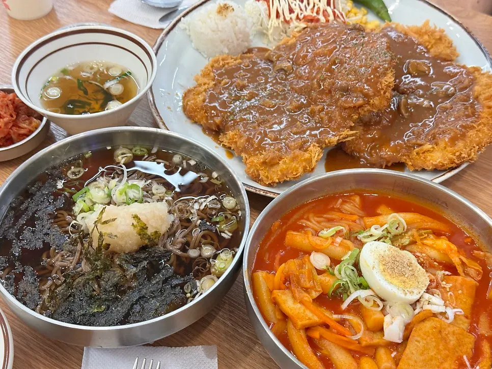 Table spread with double Jinsim Wang Donkatsu, tteokbokki and cold soba