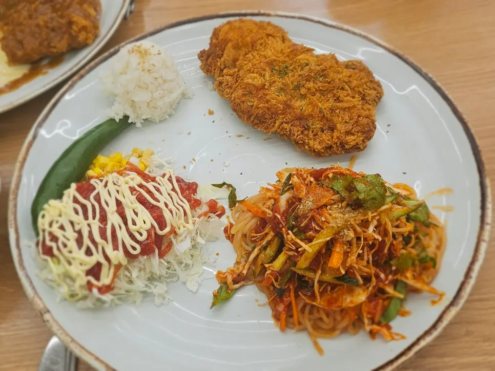Jjolmyeon Katsu served with jjolmyeon, rice, and cabbage salad