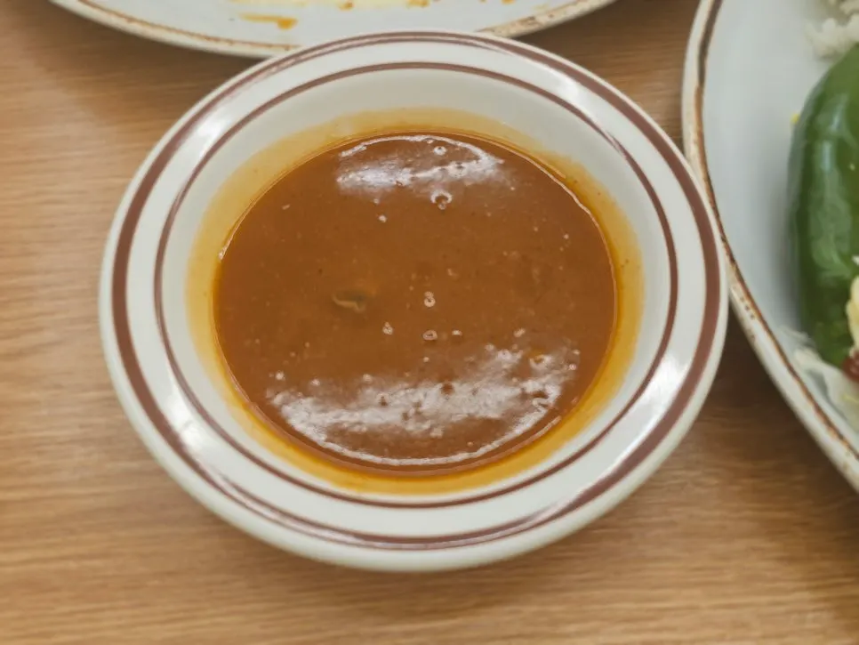 Extra katsu sauce served in a small bowl on request