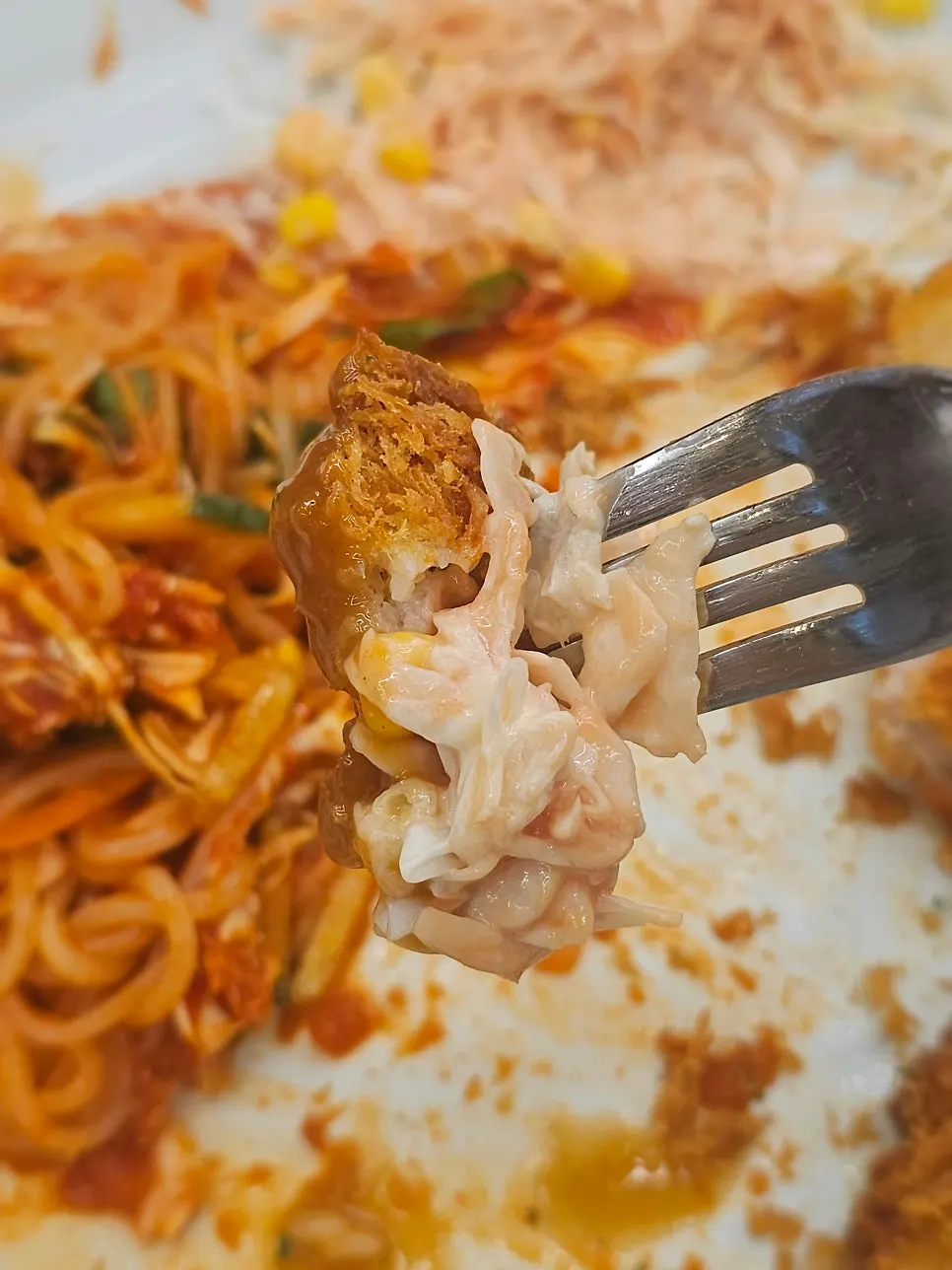 Close-up of a sauce-coated piece of katsu