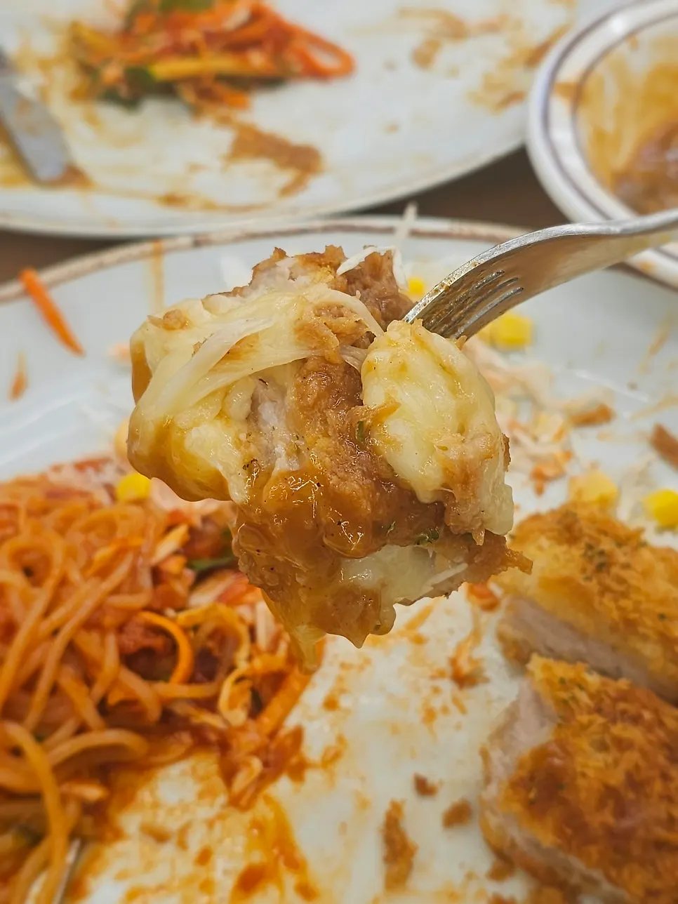 A piece of katsu topped with jjolmyeon