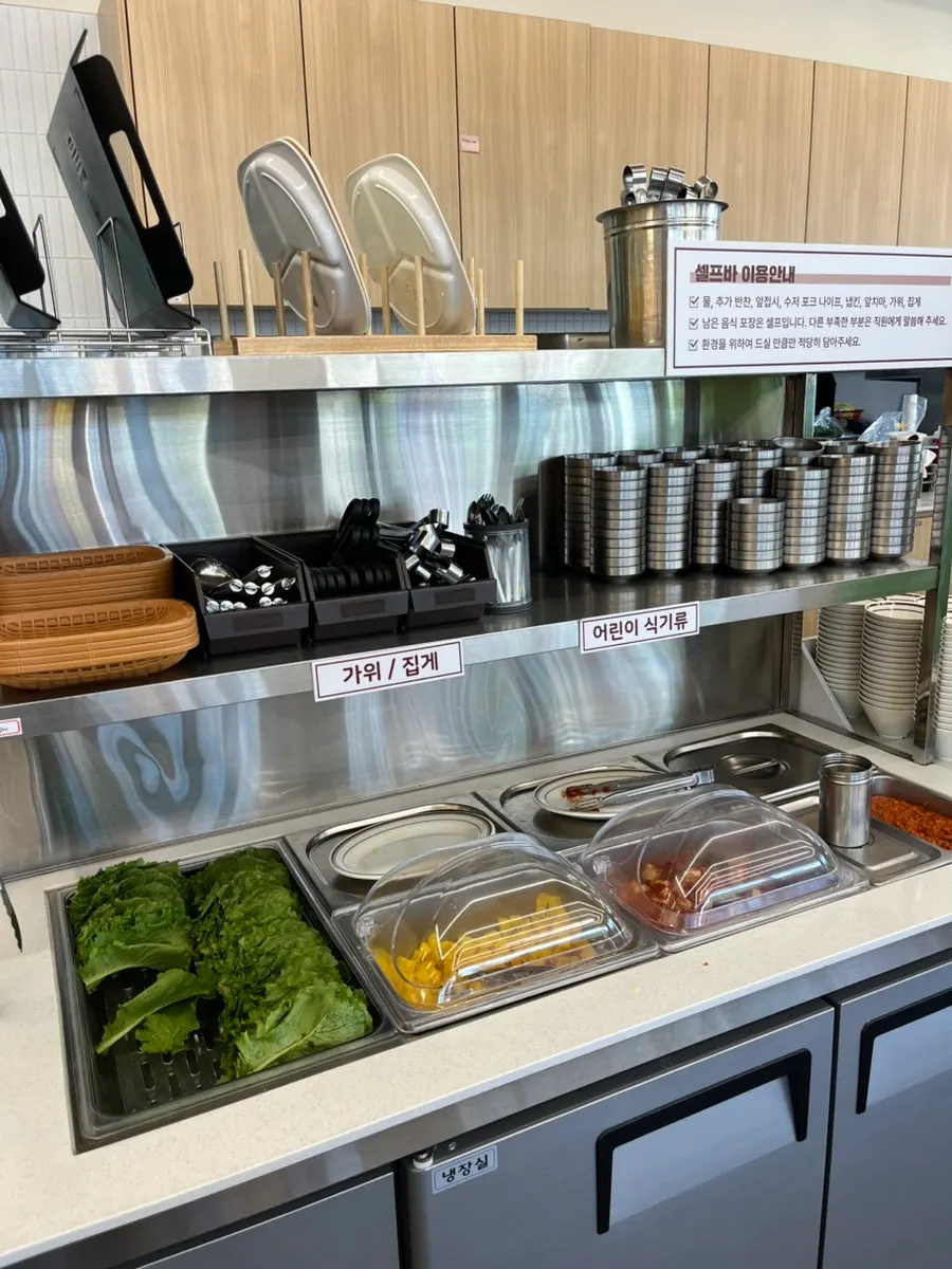 Soup and jang-guk set out at the self-serve bar