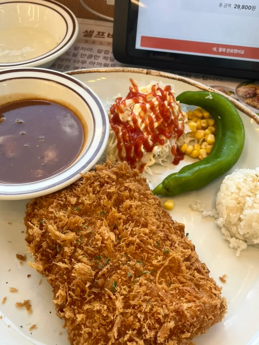 Cross-section of the fish cutlet with tartar sauce
