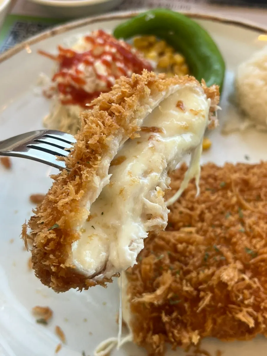 Cheese stretching out from inside the cheese katsu
