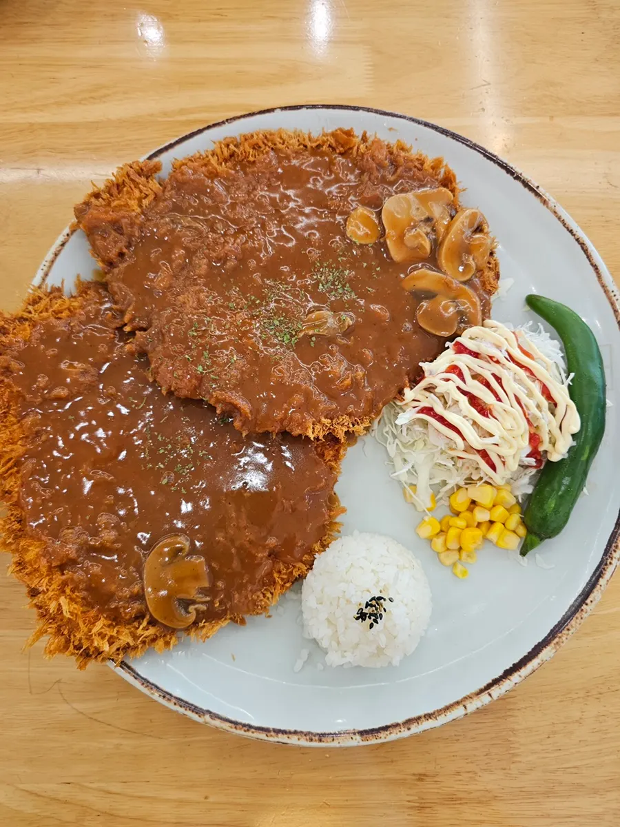 A plate of Jinsim Double Wang Pork Cutlet