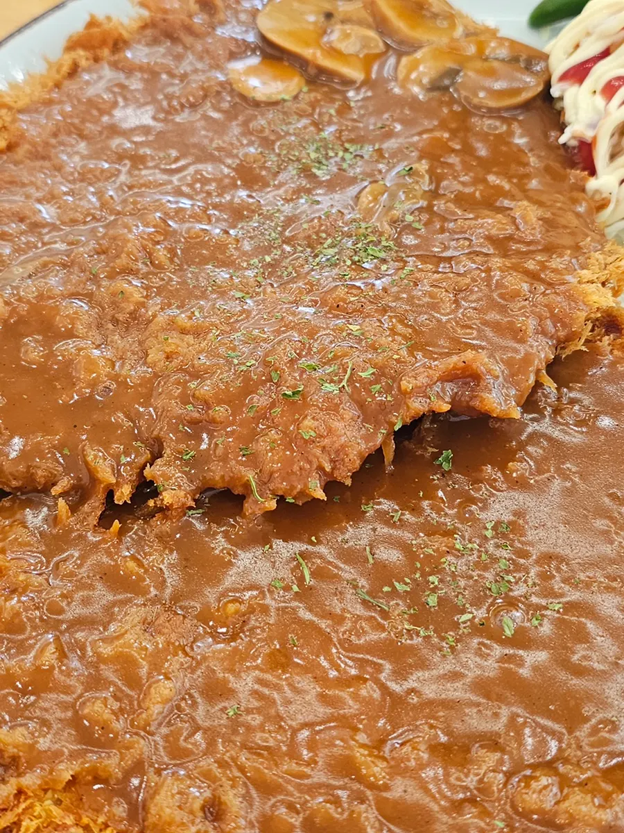 Wang donkkaseu generously covered in sauce