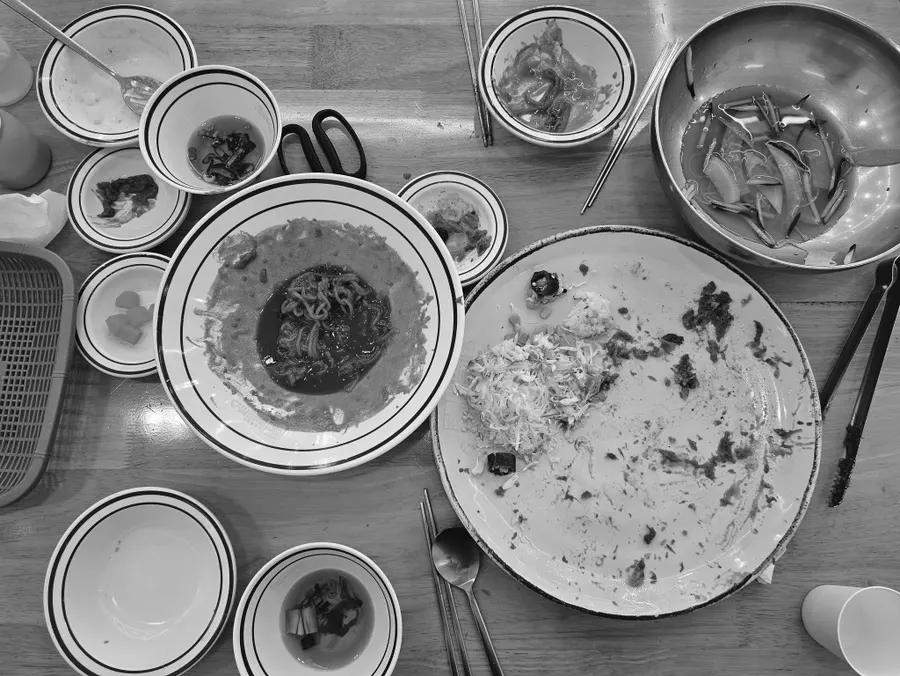 A full spread of pork cutlet, naengmyeon and tteokbokki