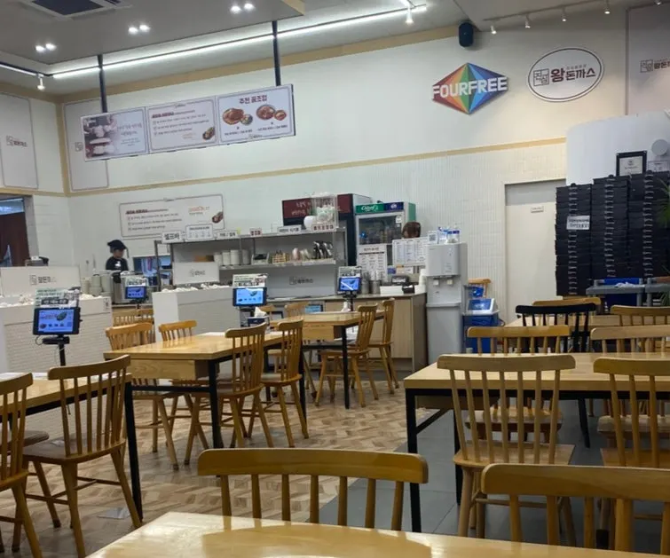 Bright, comfortable dining hall at Jinsim Wang Donkkaseu Cheomdan