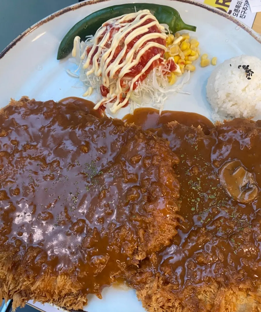 Jinsim Wang Double Pork Cutlet filling the plate