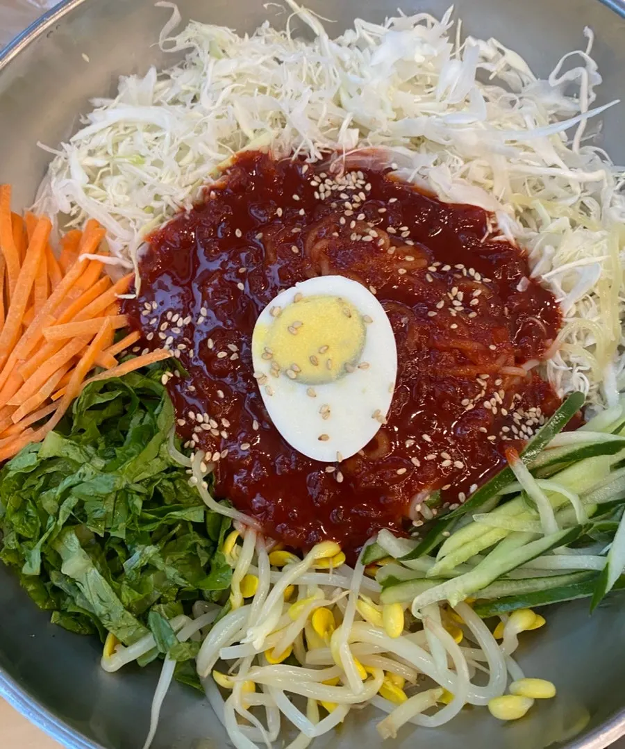 Jinsim Wang Jjolmyeon topped with vegetables and egg