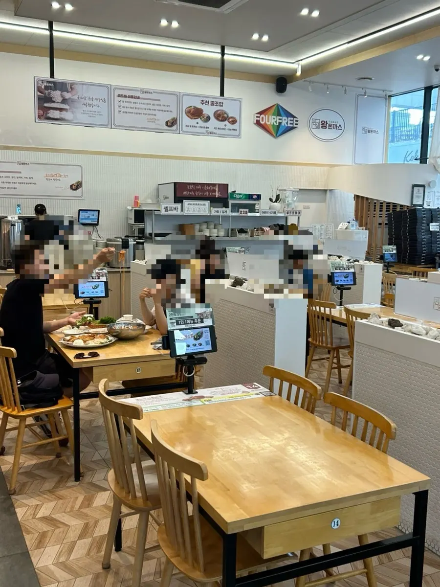 Dining hall seating with generous table spacing at the pork cutlet restaurant
