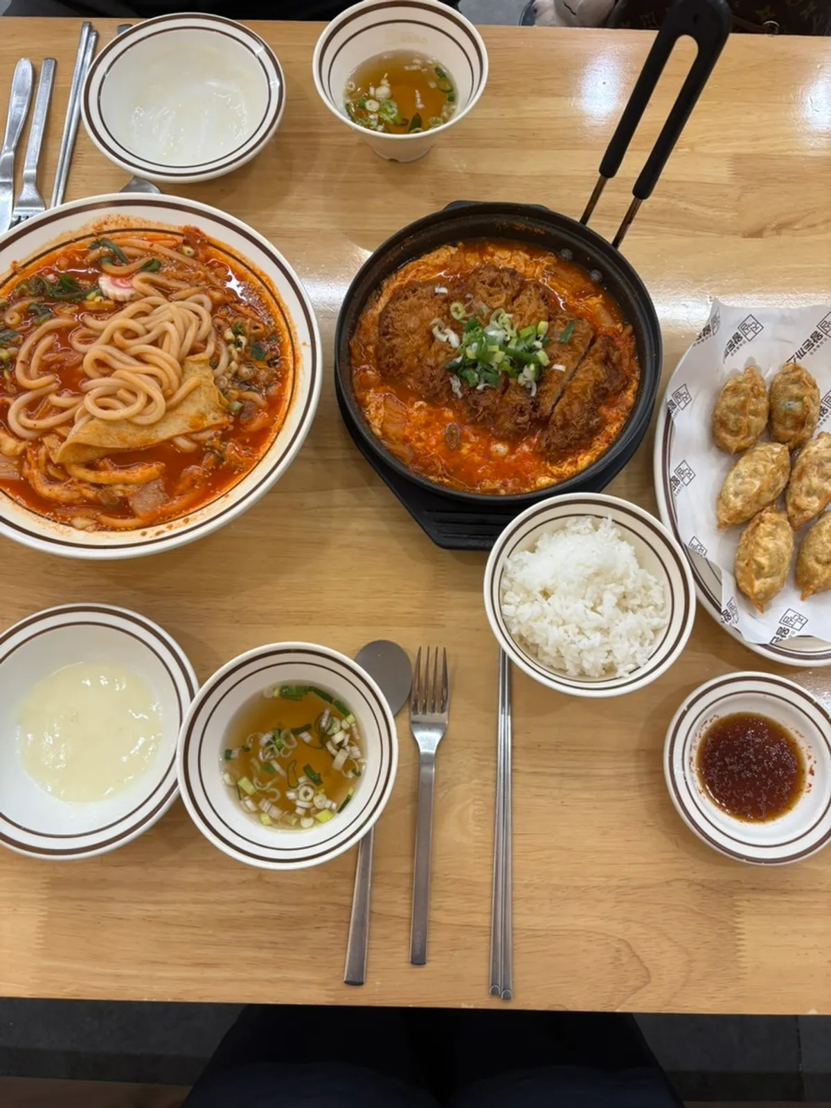 Full table spread with kimchi udon and cutlet kimchi nabe