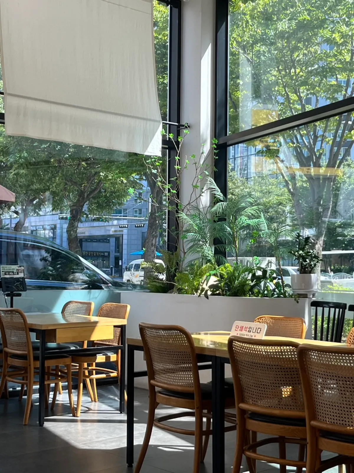 Wide dining room seating with large windows