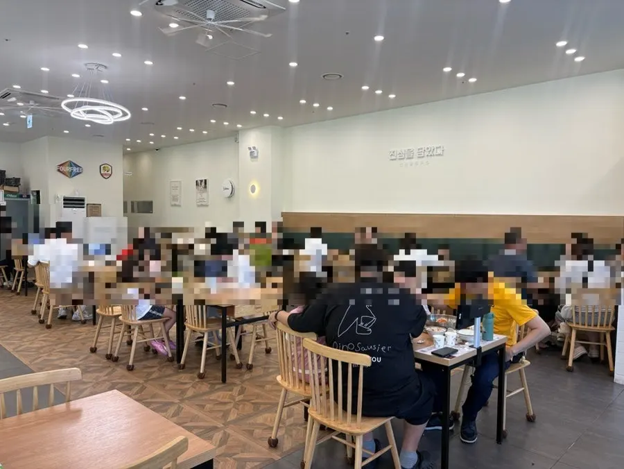 Seating area inside with many families with children