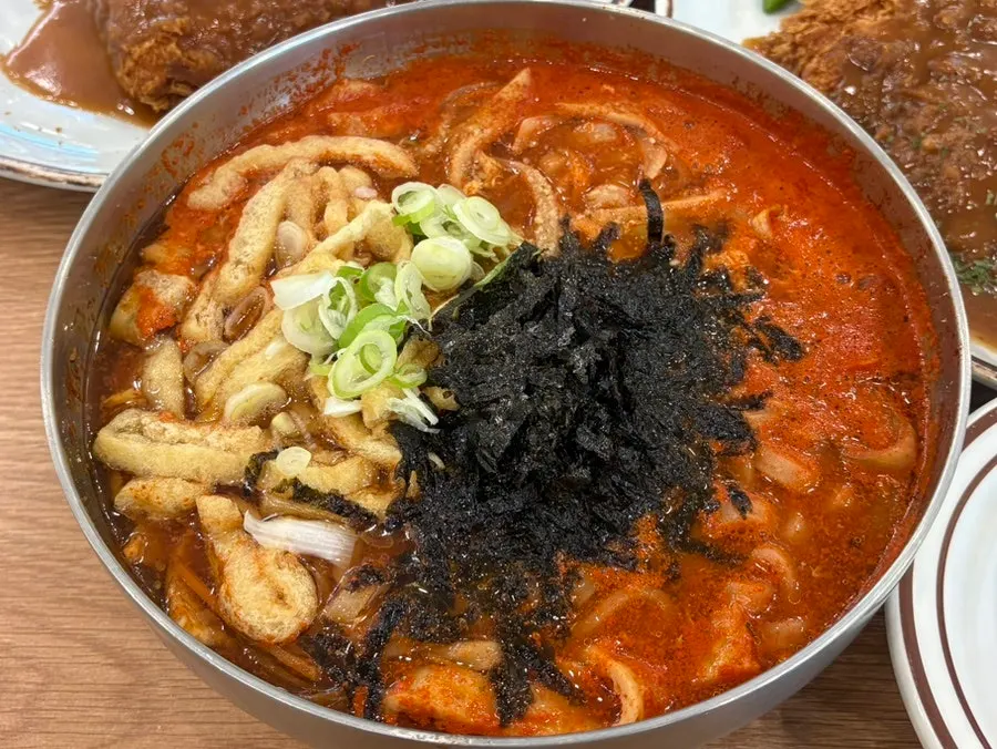 A bowl of spicy anchovy kalguksu noodle soup