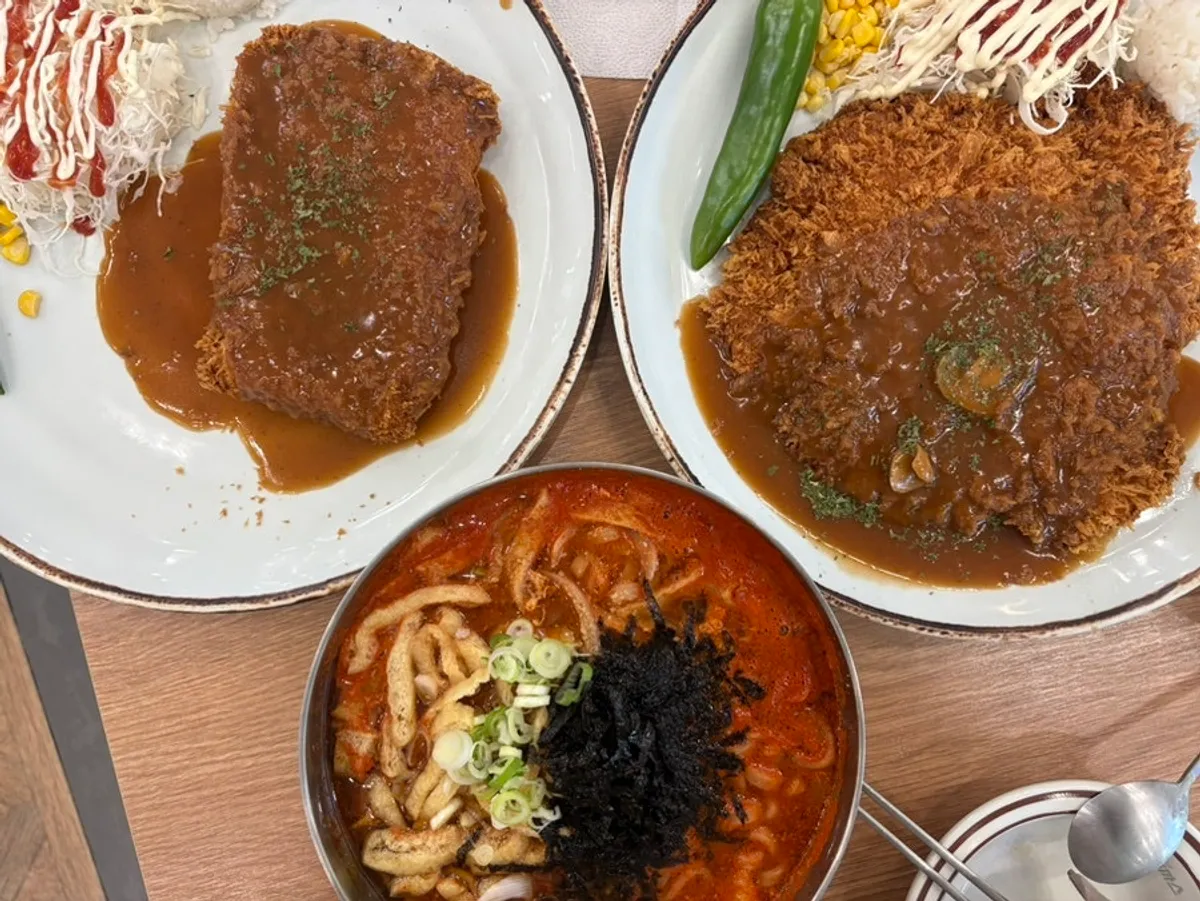 Table set with signature pork cutlet, cheese cutlet, and kalguksu for two people, three dishes