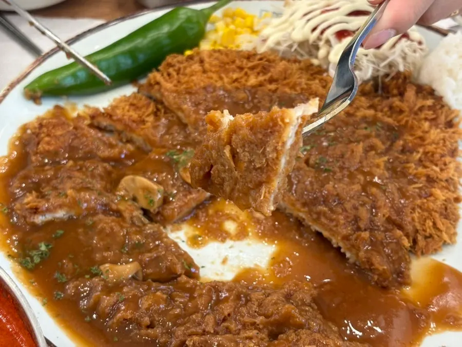 Sliced cross-section of the signature pork cutlet