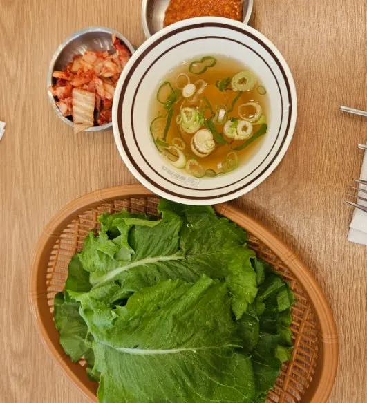 Cross-section of wang donkkaseu topped with sauce