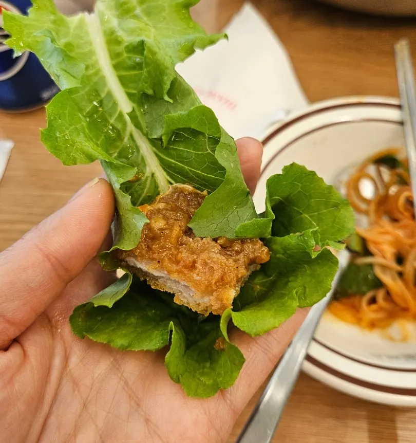 A crispy-breaded piece of wang donkkaseu