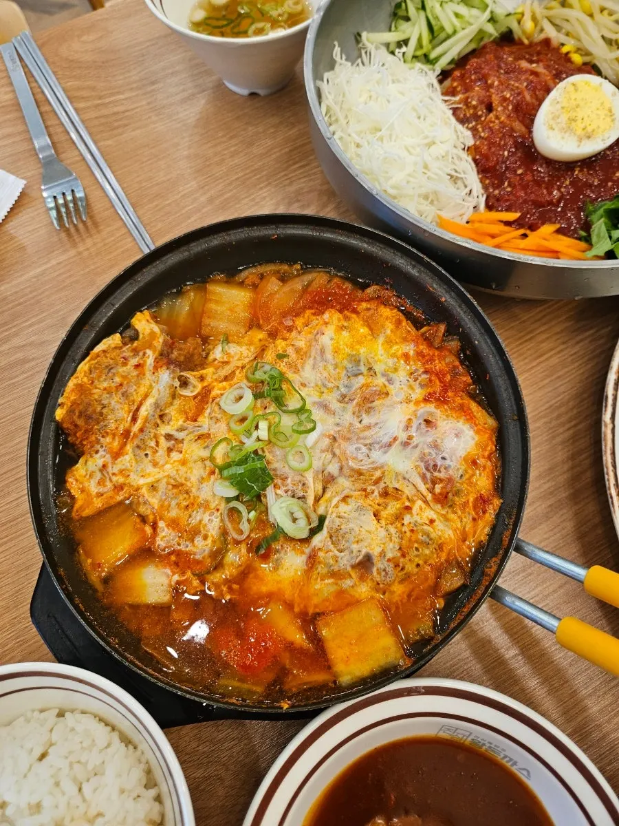 A bite combining jjolmyeon and cutlet
