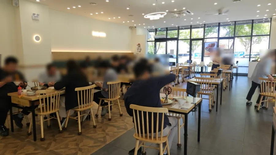 Interior of the cutlet restaurant packed with lunchtime customers