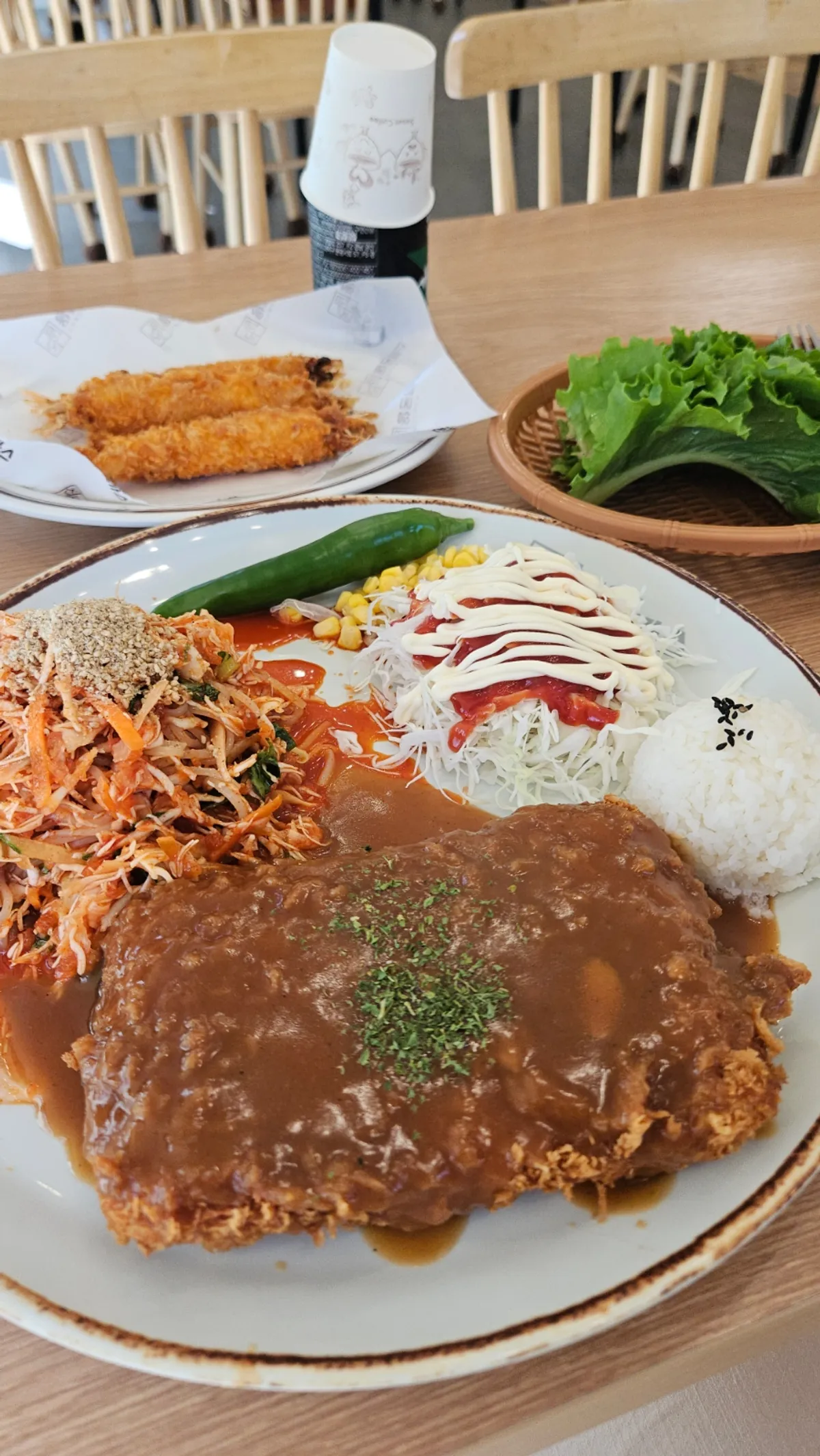 The jjolmyeon cheese cutlet, overwhelming in size