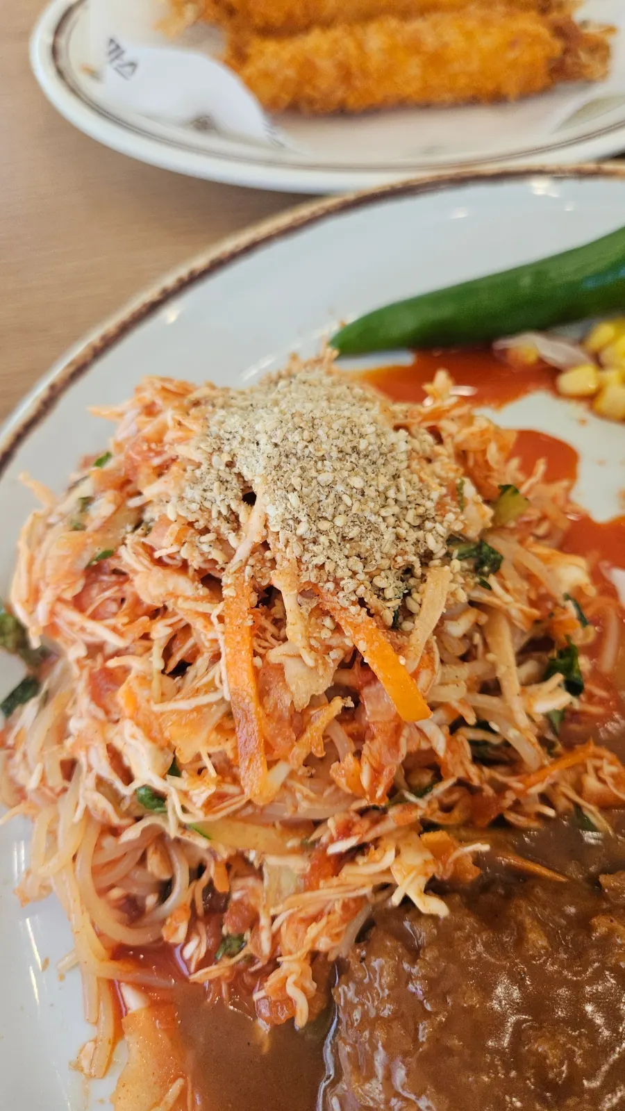 Spicy-sweet jjolmyeon paired with the cheese cutlet