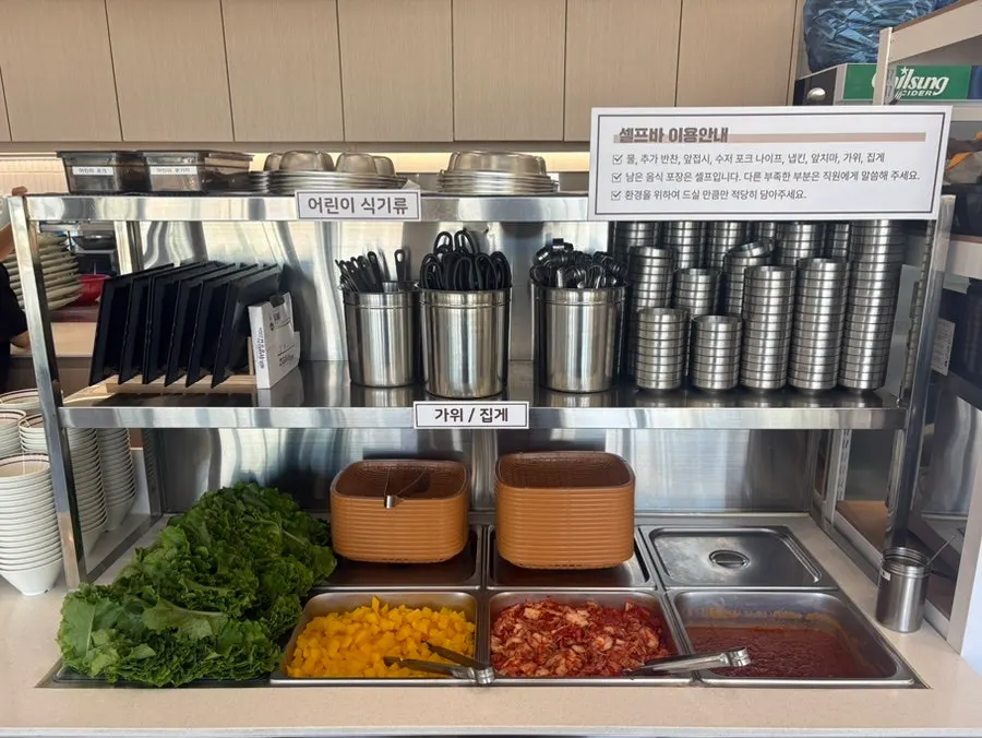 Self-serve bar stocked with vegetables and side dishes