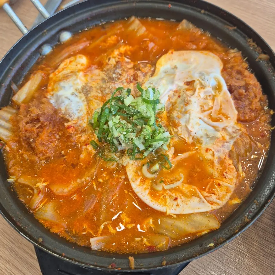Kimchi and donkatsu submerged in nabe broth