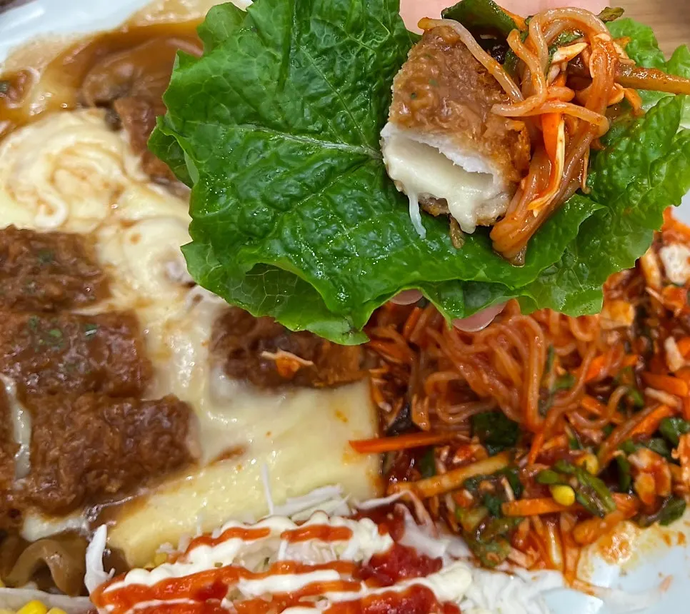 Lettuce wrap topped with tonkatsu and jjolmyeon