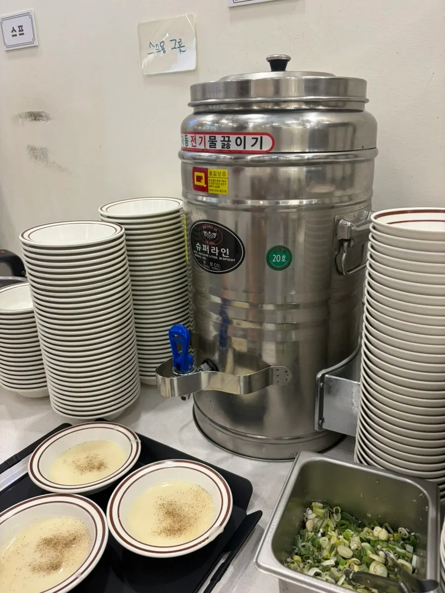 Dishes laid out on the table at Jinsimwang Donkatsu Seogwangju Branch