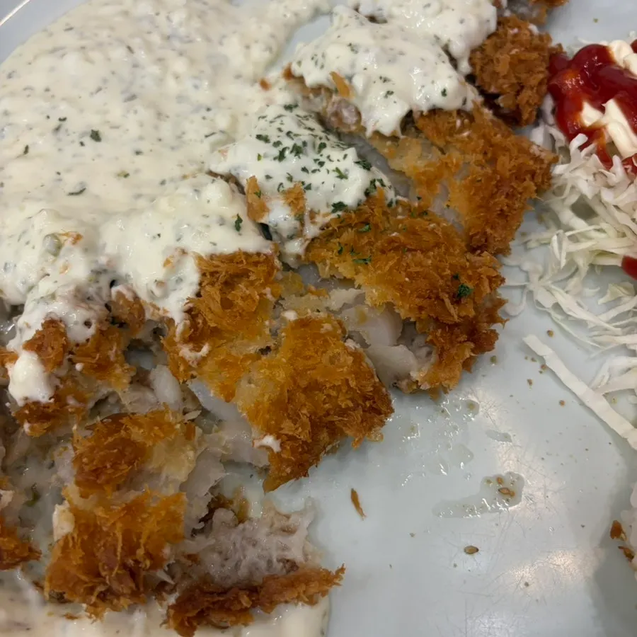 Tonkatsu set with cabbage salad and cucumber peppers on the side