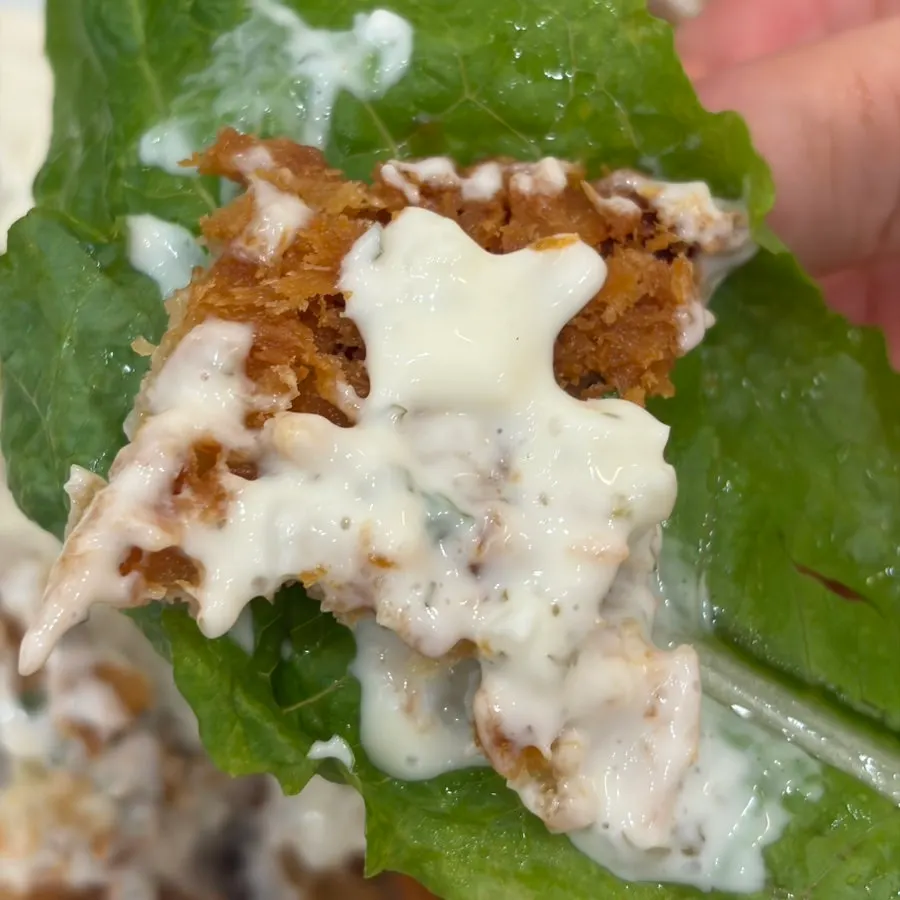 Fish cutlet eaten as a lettuce wrap