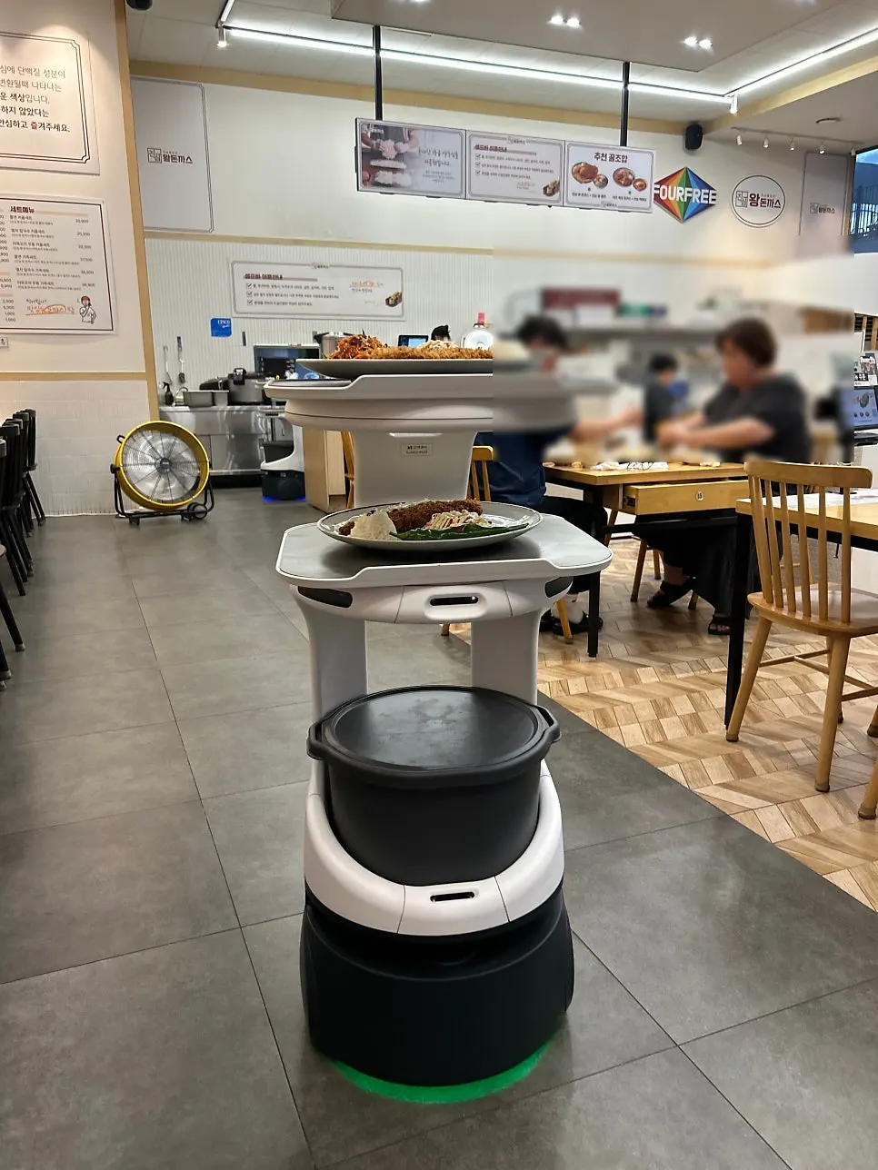 Serving robot carrying food