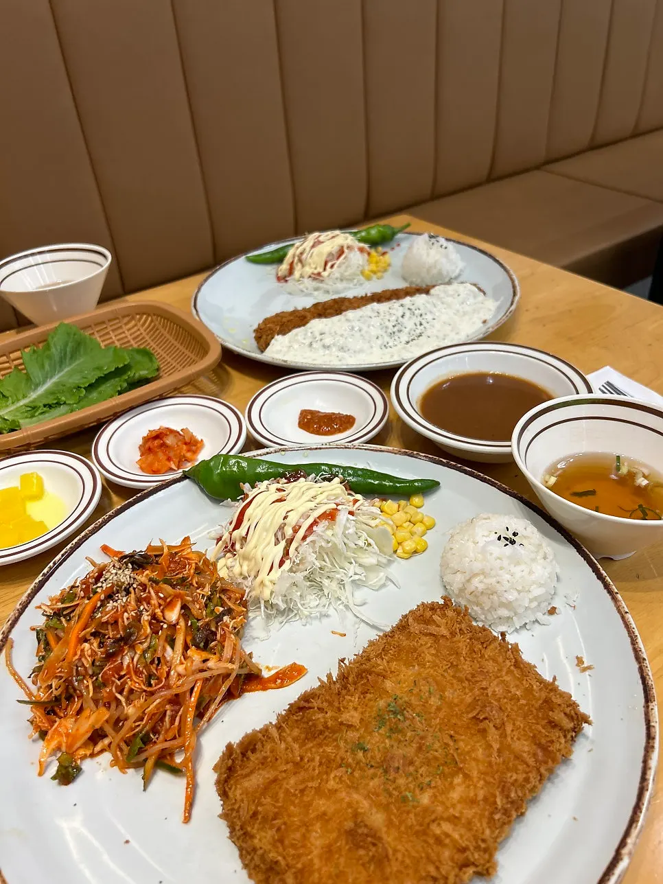 Two plates of cheese cutlet and fish cutlet